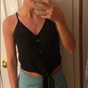 Black top with tie at the bottom